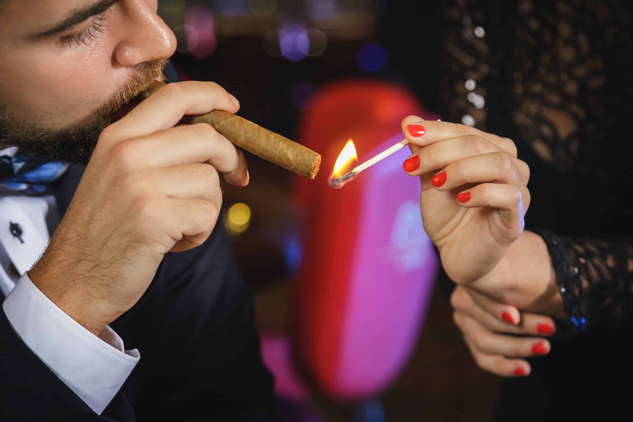 Portrait of handsome young man with a cigar