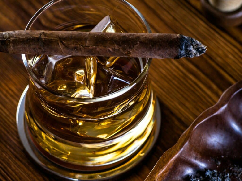 The Cigar Store Whisky on the rocks and a cigar